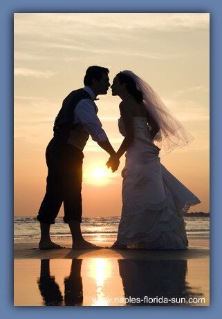 couple kissing sunset. married couple kissing at